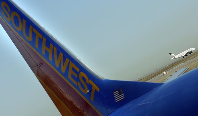 FILE: Flights from Southwest Airlines and Frontier Airlines at Denver International Airport in December 2006.