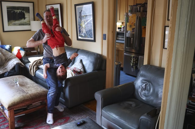 Jake Heinrichs plays with his 3-year-old son, Sam, after his infusion treatment with an experimental anti-amyloid Alzheimer's drug in New York, on Wednesday, March 12, 2025. (AP Photo/Heather Khalifa)