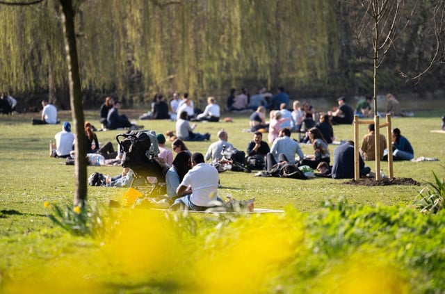 People sit in the sun in Regent&#39;s Park during an earlier warm spell this month (Photo: James Manning/PA Wire)