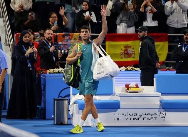 Tennis - Qatar Open - Khalifa International Tennis and Squash Complex, Doha, Qatar - February 20, 2025  Spain's Carlos Alcaraz waves to the crowd after losing his quarter final match against Czech Republic's Jiri Lehecka REUTERS/Ibraheem Al Omari/File Photo