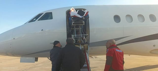 Guo Jiaxuan being loaded onto a chartered flight back to Beijing. Photo: WeChat