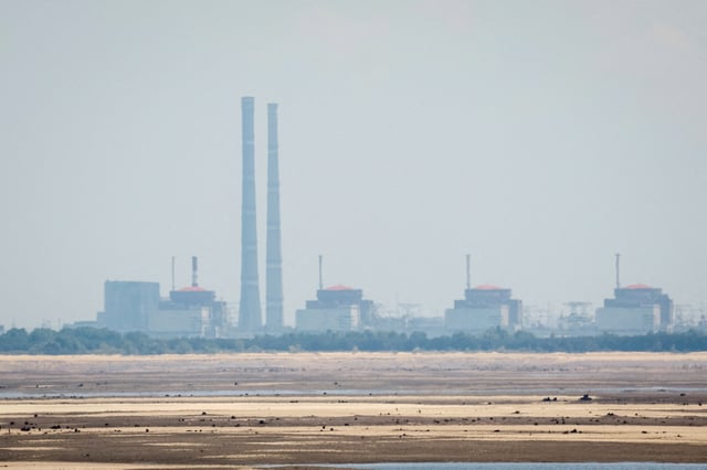 A view shows Zaporizhzhia Nuclear Power Plant from the bank of Kakhovka Reservoir near the town of Nikopol after the Nova Kakhovka dam breached, amid Russia's attack on Ukraine, in Dnipropetrovsk region, Ukraine June 16, 2023. REUTERS/Alina Smutko/File Photo