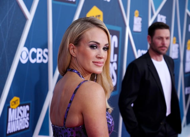 Carrie Underwood and Mike Fisher attend the 2022 CMT Music Awards at Nashville Municipal Auditorium on April 11, 2022 in Nashville, Tennessee.