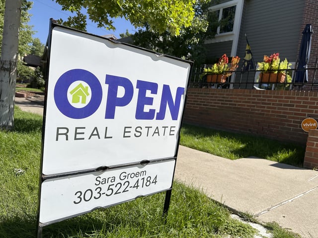 FILE - A sign stands outside a home for sale in the Alamo Placits neighborhood Tuesday, Aug. 27, 2024, in central Denver. (AP Photo/David Zalubowski, File)