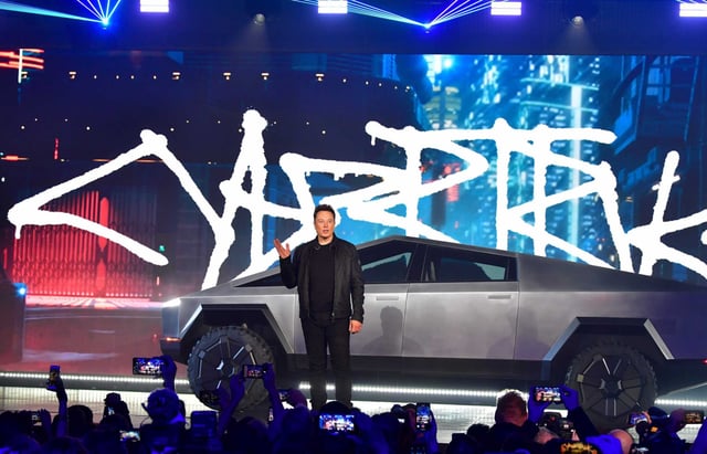 Tesla chief executive Elon Musk stands in front of the newly unveiled all-electric battery-powered Tesla&#39;s Cybertruck at Tesla Design Center in Hawthorne, in 2019. On Thursday, Tesla announced a recall of more than 46,000 Cybertrucks due to concerns that a cosmetic exterior trim panel could detach, creating a potential road hazard. 