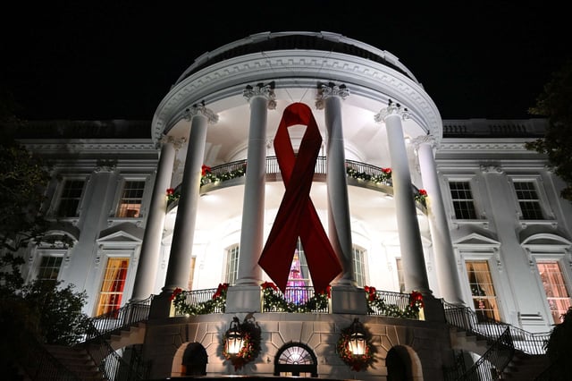 A red ribbon is displayed on the South Lawn of the White House to recognize World AIDS Day on December 1, 2024, in Washington, D.C.