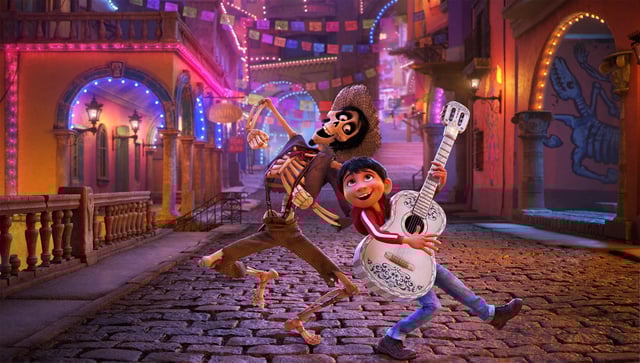 Hector and Miguel dancing down the street in Coco.