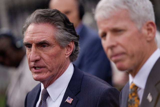 U.S. Secretary of the Interior Doug Burgum and U.S. Secretary of Energy Chris Wright speak with members of the media outside of the West Wing of the White House, in Washington, D.C., U.S., March 19, 2025. REUTERS/Kent Nishimura