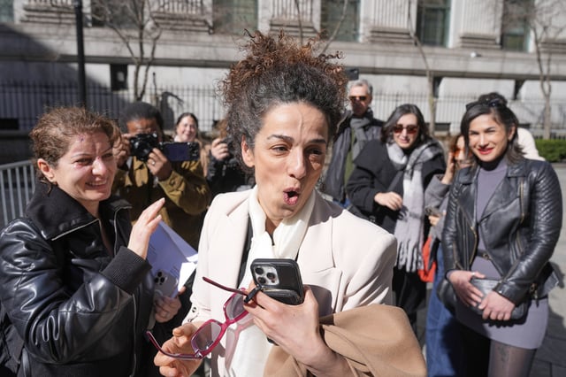 Masih Alinejad greets friends and supporters outside the federal courthouse after testifying at the trial of her would-be assassins in New York, Tuesday, March 18, 2025. (AP Photo/Seth Wenig)