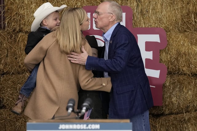 Rep. John Rose, R-Tenn., right, kisses his wife Chelsea Rose, left, before announcing his candidacy for the 2026 gubernatorial election Thursday, March 20, 2025, in Lebanon, Tenn. (AP Photo/George Walker IV)
