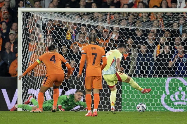 Soccer Football - Nations League - Quarter Final - First Leg - Netherlands v Spain - Feyenoord Stadium, Rotterdam, Netherlands - March 20, 2025 Spain's Mikel Merino scores their second goal REUTERS/Fabian Bimmer