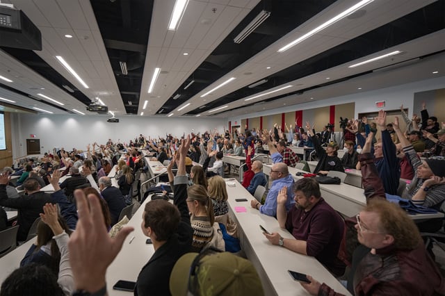 Concerned citizens raise their hands during a GOP town hall meeting with Reps. Celeste Malloy and Mike Kennedy, R-Utah, Thursday, March 20, 2025, in Salt Lake City. (AP Photo/Rick Egan)