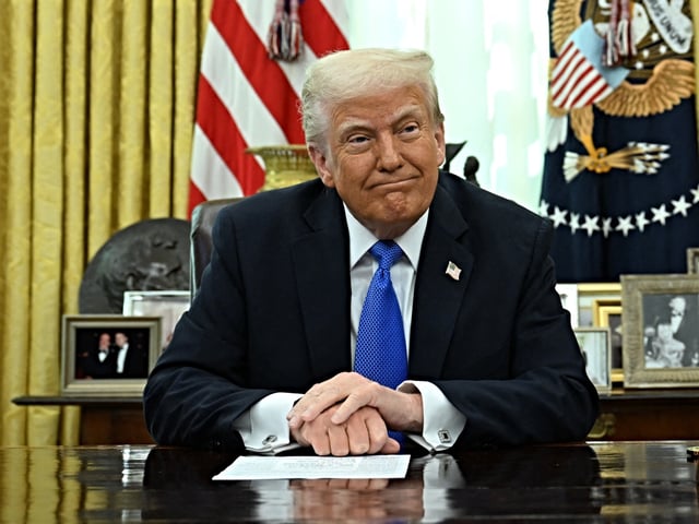 US President Donald Trump and Secretary of Defense Pete Hegseth prepare to speak to the press in the Oval Office of the White House in Washington, DC, on March 21, 2025. (Photo by Annabelle Gordon / AFP)