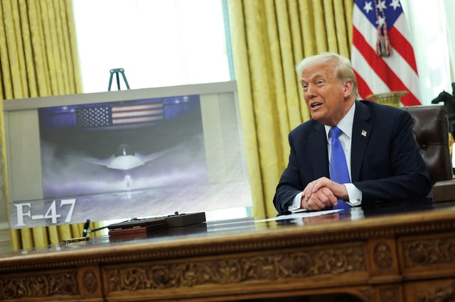 President Donald Trump delivers remarks as an image of an F-47 sixth-generation fighter jet is displayed in the Oval Office at the White House in Washington, DC, on March 21, 2025.