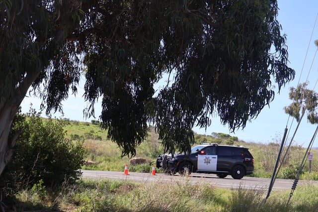 A Palo Alto police vehicle closes off access to the Baylands as officers investigate a death near Byxbee Park on March 21. Photo by Gennady Sheyner