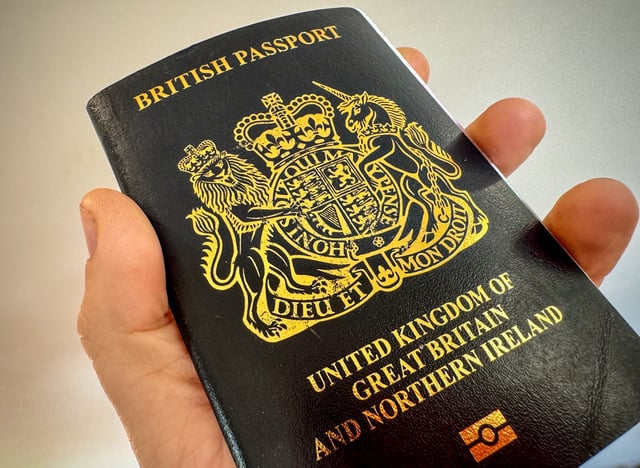 A man holds a post-Brexit United Kingdom issued passport on October 26, 2023 near Bath, England.