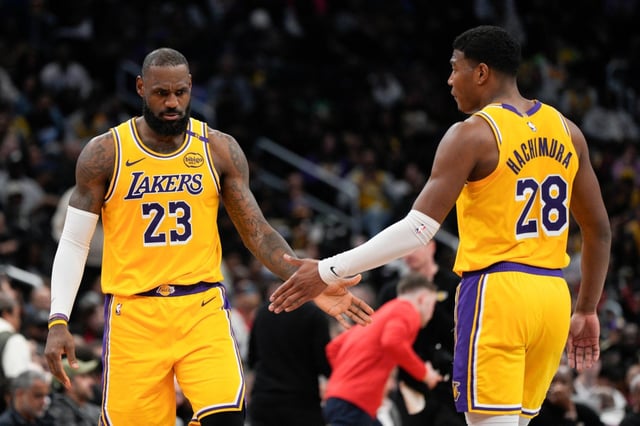 Lakers forwards LeBron James, left, and Rui Hachimura, shown in an image from earlier this season, have been upgraded to questionable for Saturday night’s home game against the Bulls. James has missed the past seven games with a groin injury and Hachimura has missed 10 straight games with patellar tendinopathy. (AP Photo/Jess Rapfogel)