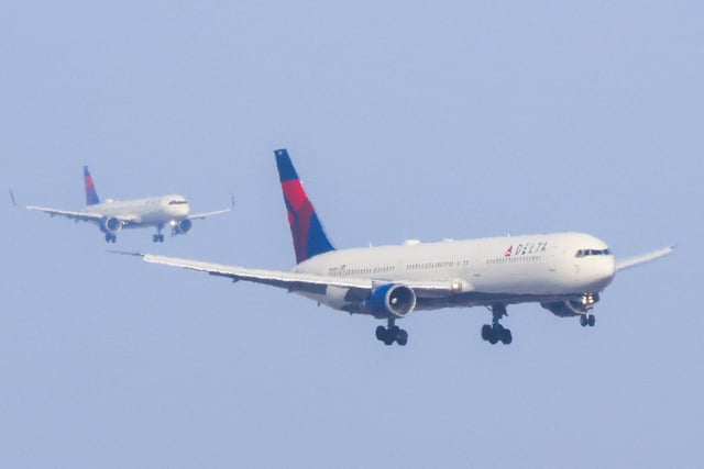 A Boeing 767-432 passenger aircraft of Delta Airlines can be seen approaching John F. Kennedy International Airport in New York City on March 4, 2025. (Photo by CHARLY TRIBALLEAU / AFP) (Photo by CHARLY TRIBALLEAU/AFP via Getty Images)