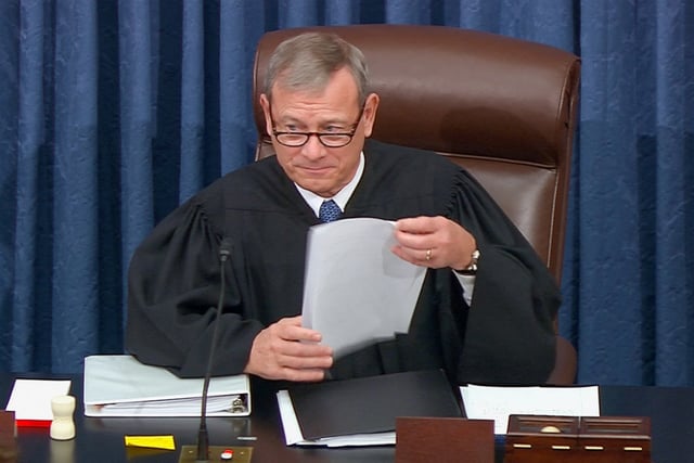 Chief Justice of the United States John Roberts presides during opening arguments in the U.S. Senate impeachment trial of U.S. President Donald Trump in this frame grab from video shot in the U.S. Senate Chamber at the U.S. Capitol in Washington, U.S., January 21, 2020.