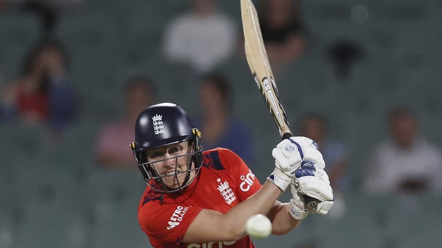 Heather Knight of England plays a shot during the Women's T20 cricket international cricket match between England and Australia at Adelaide Oval in Adelaide, Australia, Saturday, Jan. 25, 2025. (AP Photo/James Elsby)