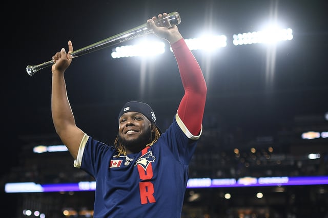 DENVER, COLORADO - JULY 13: Vladimir Guerrero Jr. #27 of the Toronto Blue Jays celebrates after being awarded the MVP during the 91st MLB All-Star Game at Coors Field on July 13, 2021 in Denver, Colorado. The American League defeated the National League 5-2.