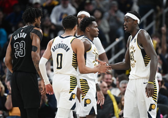 Mar 22, 2025; Indianapolis, Indiana, USA; Indiana Pacers guard Tyrese Haliburton (0) and forward Pascal Siakam (43) high-five during the second half against the Brooklyn Nets at Gainbridge Fieldhouse. Mandatory Credit: Robert Goddin-Imagn Images