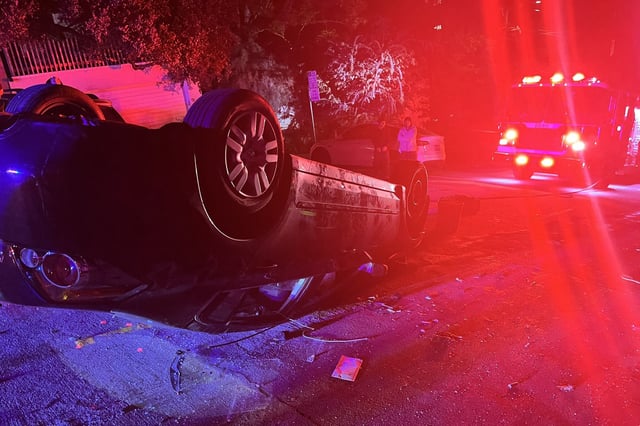 San Francisco firefighters respond to a vehicle rollover at Hyde and Chestnut streets around Saturday midnight. 