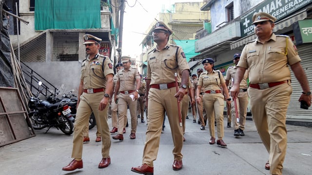 Nagpur, Mar 23 (ANI): Nagpur Police Commissioner Ravindra Singal along with other police officials conducts a march as the curfew was lifted after six days of violence, in Nagpur on Sunday. (ANI Photo)
