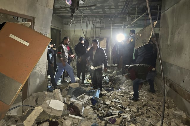 Rescue workers inspect a room at Nasser hospital after it was hit by a targeted Israeli army strike in Khan Younis, southern Gaza Strip, Sunday, March 23, 2025. (AP Photo/Mohammad Jahjouh)