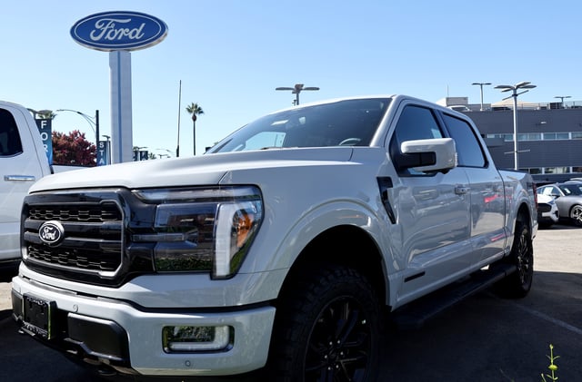 A Ford F-150 Lariat PowerBoost hybrid pickup truck is displayed for sale at a Ford dealership on August 21, 2024, in Glendale, California.  Some F-150 models are being investigated for alleged downshifting problems this week.