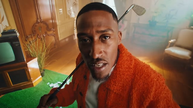 A photo of Yung Filly singing in a music video.
