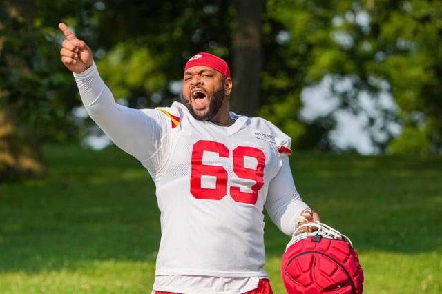 Jul 22, 2024; St. Joseph, MO, USA; Kansas City Chiefs defensive tackle Mike Pennel Jr. (69) gestures to fans while walking from the locker room to the fields prior to training camp at Missouri Western State University. Mandatory Credit: Denny Medley-USA TODAY Sports/File Photo