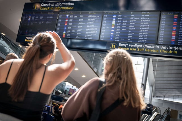 Passengers are seen at Copenhagen Airport in Denmark on July 19, 2022.