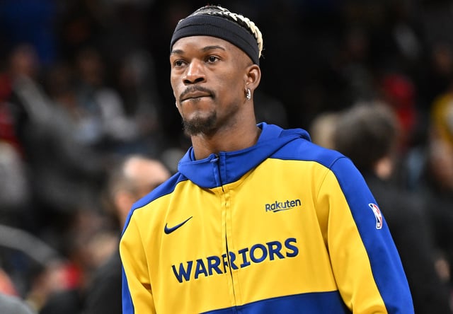 Jimmy Butler III #10 of the Golden State Warriors warms up before the game against the Atlanta Hawks at State Farm Arena on March 22, 2025 in Atlanta, Georgia.