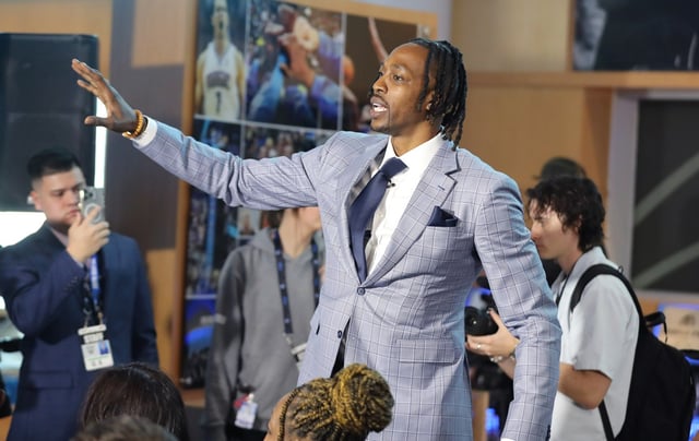 Dwight Howard waves to attendees as he is inducted into the Orlando Magic Hall of Fame during ceremonies at the Kia Center in Orlando on Monday, March 24, 2025. Howard is the 13th inductee into the team’s hall of fame. He played for the Magic from 2004-2012. Howard is the Orlando Magic’s all-time leader in points scored (11,435), rebounds (8,072), blocked shots (1,344), free throws made (3,366), free throws attempted (5,727) and minutes played (22,471). (Stephen M. Dowell/Orlando Sentinel)