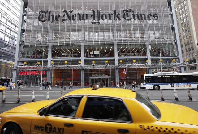 FILE - Traffic passes The New York Times building in New York, Oct. 20, 2011. (AP Photo/Mark Lennihan, File)