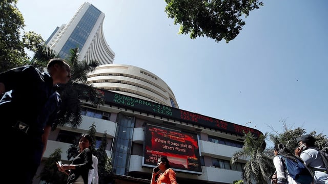 Sensex, Nifty 50 today: People walk past the Bombay Stock Exchange (BSE) building in Mumbai (Francis Mascarenhas/Reuters)