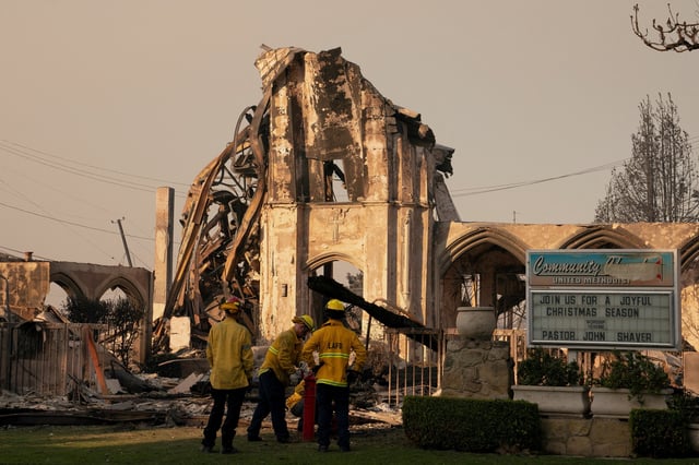Firefighters work near a church destroyed in the Palisades Fire, in the Pacific Palisades neighborhood in Los Angeles, California, U.S. January 10, 2025. REUTERS/David Ryder/File photo