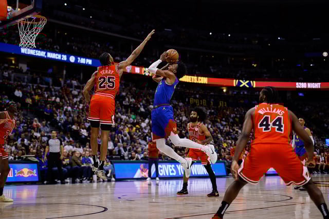 Mar 24, 2025; Denver, Colorado, USA; Denver Nuggets forward Peyton Watson (8) attempts a shot after being fouled by Chicago Bulls forward Dalen Terry (25) as forward Patrick Williams (44) looks on in the third quarter at Ball Arena. Mandatory Credit: Isaiah J. Downing-Imagn Images