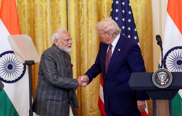 U.S. President Donald Trump and Indian Prime Minister Narendra Modi shake hands as they attend a joint press conference at the White House in Washington, D.C., U.S., February 13, 2025. REUTERS/Kevin Lamarque/File Photo