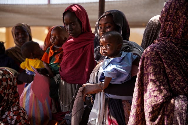 A handout photograph, shot in January 2024, shows women and babies at the Zamzam displacement camp, close to al-Fashir in North Darfur, Sudan. MSF/Mohamed Zakaria/Handout via REUTERS/File Photo