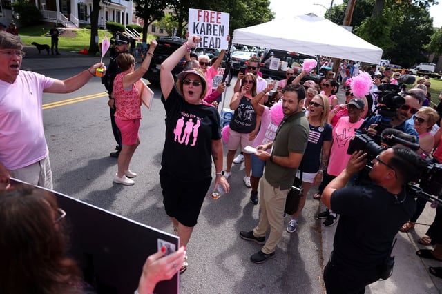 Rita Lombardi, cheers on fellow Karen Read down the street from the Norfolk County Superior Courthouse.