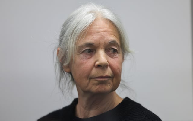 Daniela Klette, accused of being one of the last surviving members of the Red Army Faction group, who was arrested after decades on the run for armed robbery and attempted murder, reacts on the day of her trial at a regional court in Celle, Germany March 25, 2025. REUTERS/Wolfgang Rattay