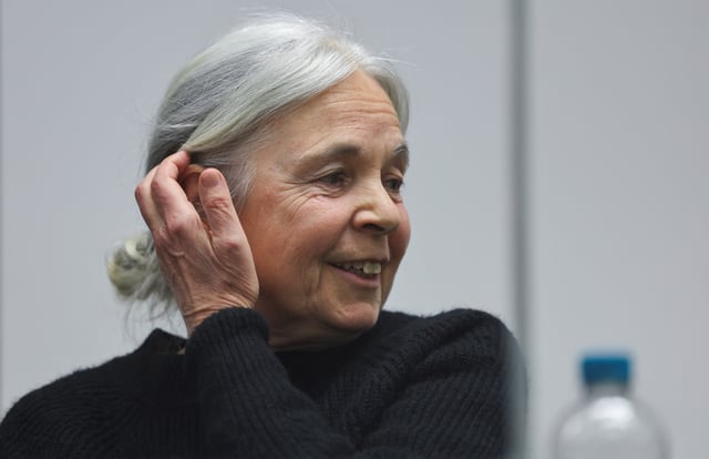 Daniela Klette, accused of being one of the last surviving members of the Red Army Faction group, who was arrested after decades on the run for armed robbery and attempted murder, reacts on the day of her trial at a regional court in Celle, Germany March 25, 2025. REUTERS/Wolfgang Rattay