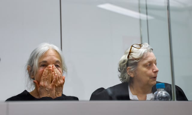 Daniela Klette, accused of being one of the last surviving members of the Red Army Faction group, who was arrested after decades on the run for armed robbery and attempted murder, reacts next to to one of her lawyers, Undine Weyers, on the day of her trial at a regional court in Celle, Germany March 25, 2025. REUTERS/Wolfgang Rattay