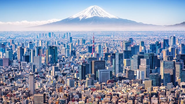 Mount Fuji looms in the distance over Tokyo
