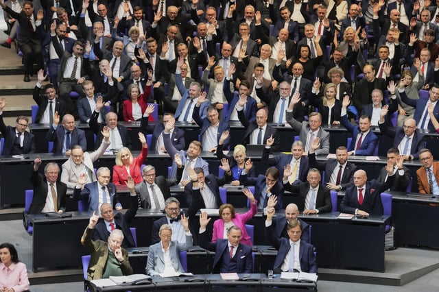 The AfD party faction votes during the constituent session of the newly elected German Parliament Bundestag in Berlin, Germany, Tuesday, March 25, 2025. (AP Photo/Markus Schreiber)