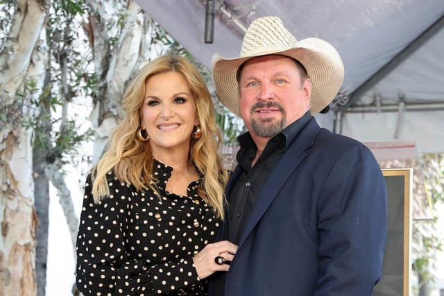 Trisha Yearwood (left) and Garth Brooks (right) pose during her Hollywood Walk of Fame Star ceremony in Hollywood, California, on March 24, 2025.