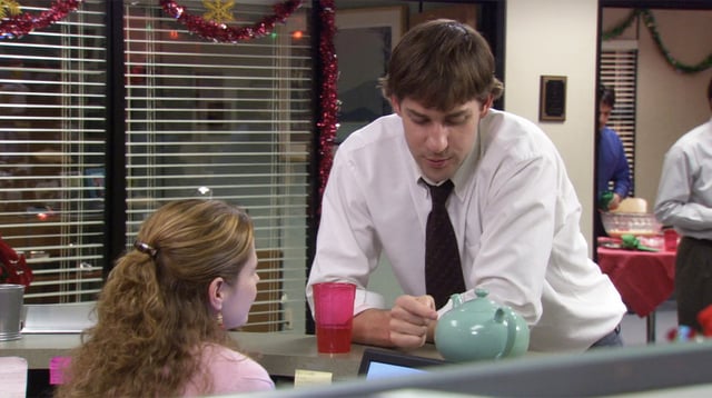 Still of "The Office" with Pam, Jim, and the teapot.