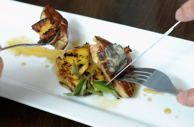 Customers eat gourmet food made with foie gras at Hot's Kitchen during a "Farewell Fois Gras" event on June 29, 2012 in Hermosa Beach, California